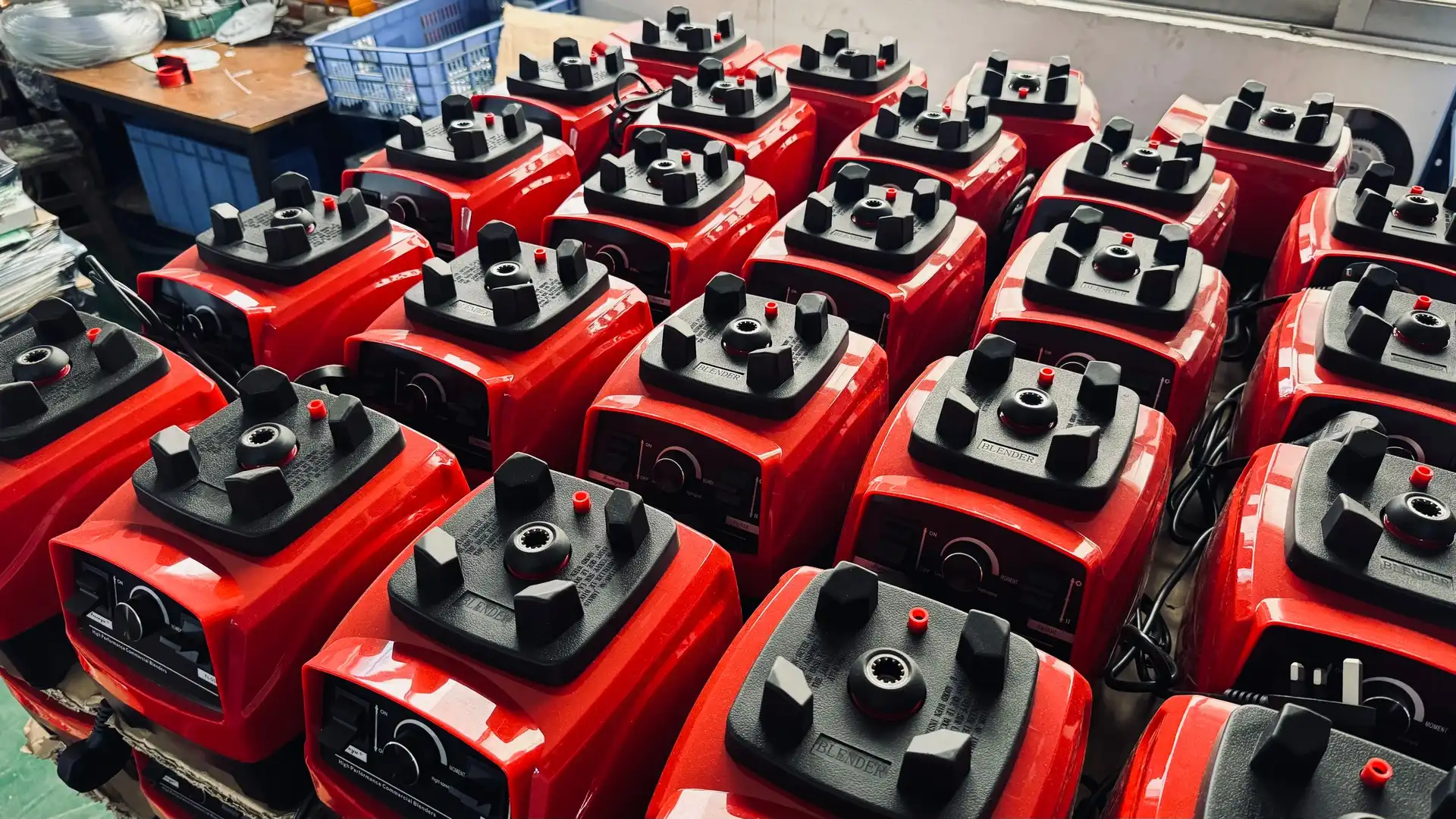 Sub-assembly inventory of juicer bases lined up in home appliance factory storage