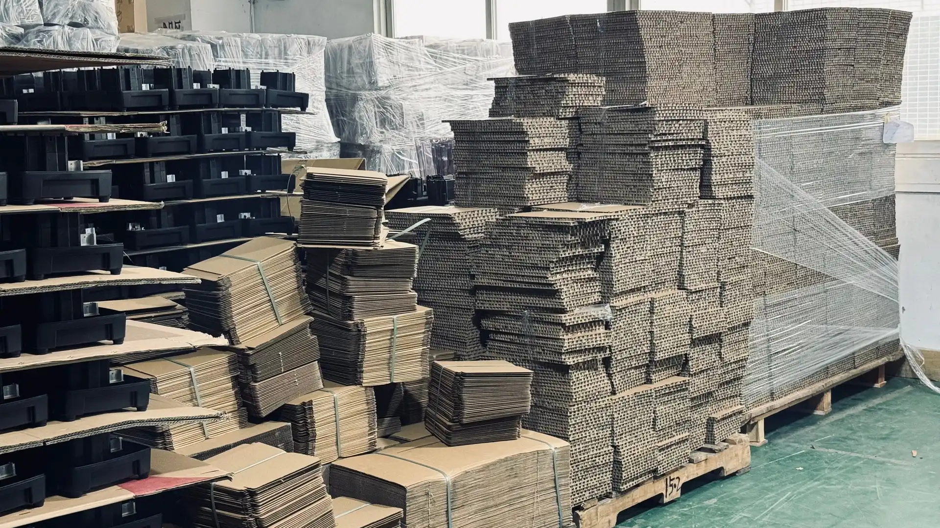 AIMA factory warehouse storage with stacked cardboard boxes ready for 40HQ container loading
