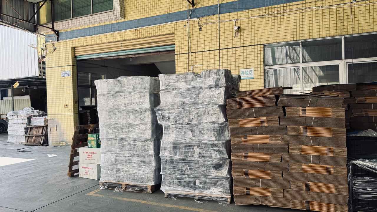 Extensive factory warehouse storage filled with stacked master cardboard boxes ready for 40HQ container loading